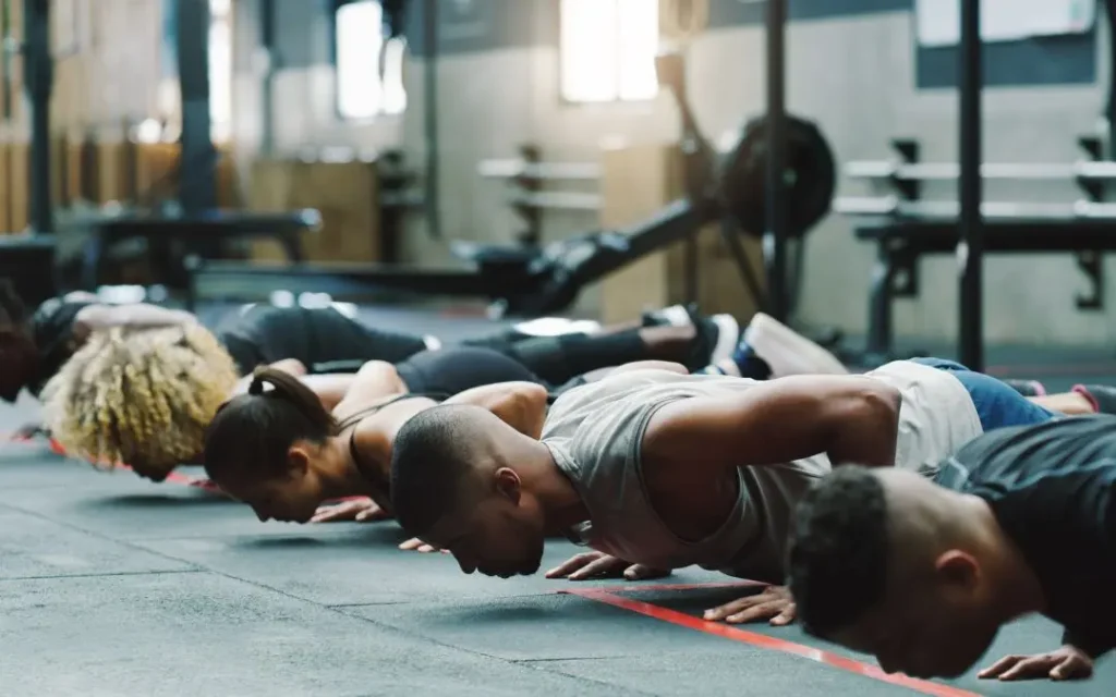 a group of athletes doing push-ups