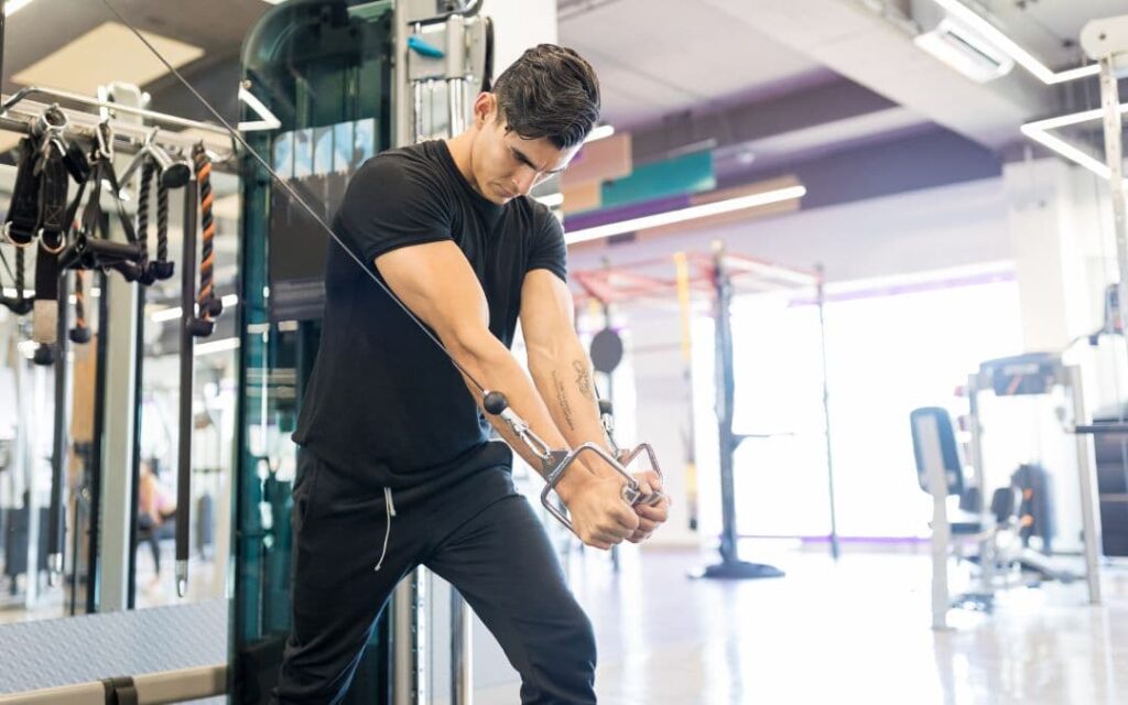a man lifting weights to build muscle mass
