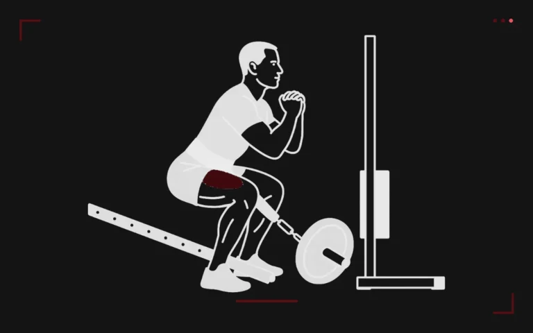 Belt squat: a man squatting with the load hanging from a belt between his legs, thighs highlighted