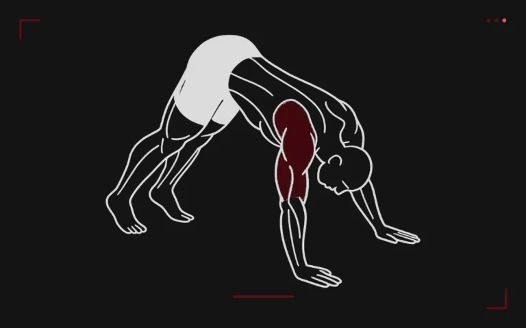 Pike push-up: a man in an inverted V with hips high, lowering his head toward the floor, shoulders highlighted