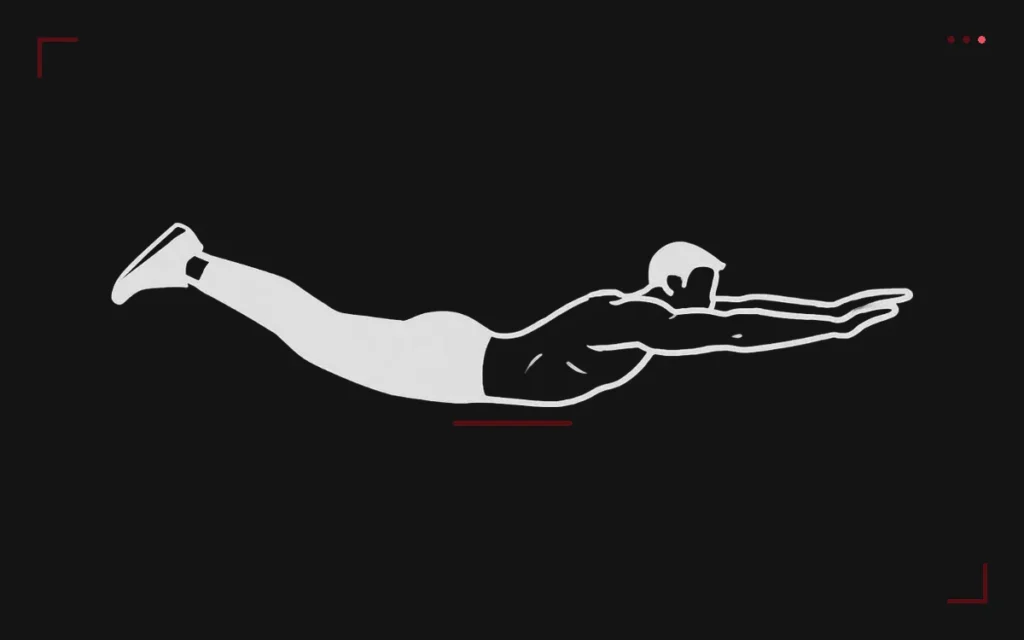Superman hold: a man lying face down with arms and legs straight and lifted off the floor